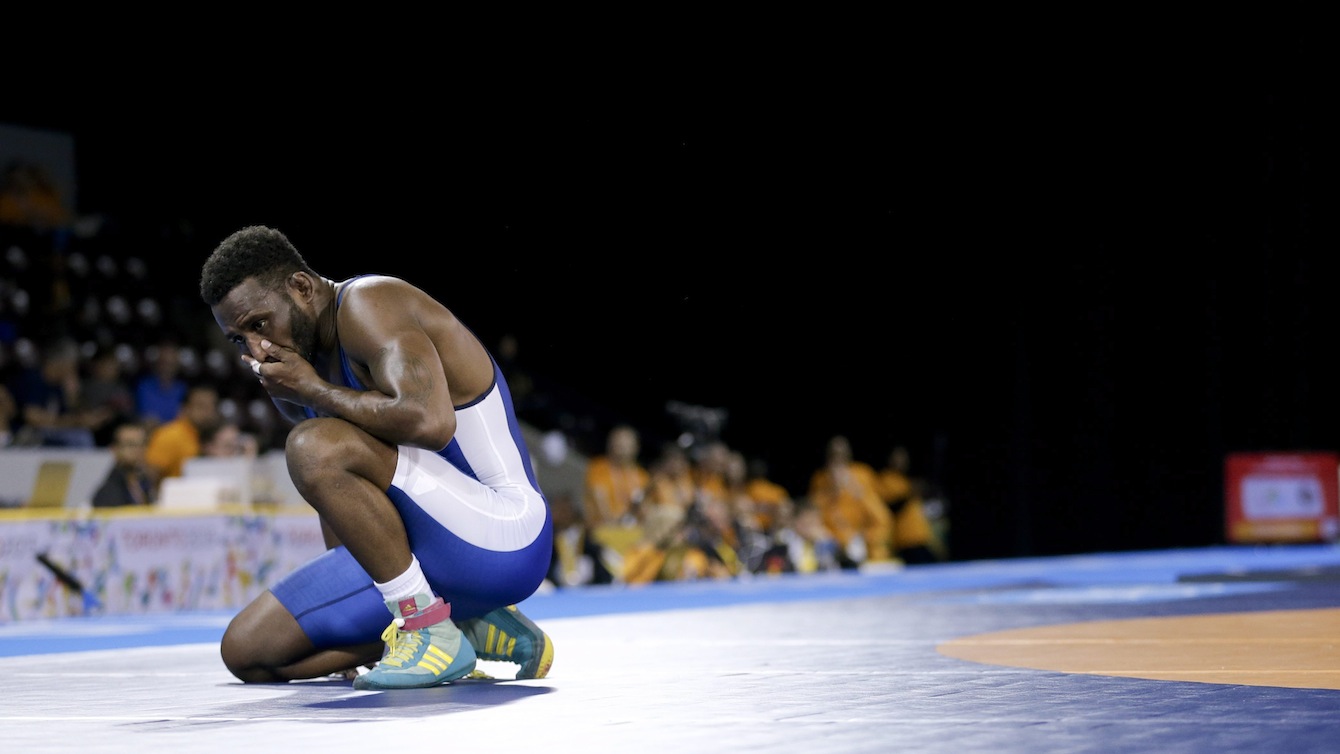 Canada's Haislan Garcia reacts to losing in the men's freestyle 65 kg semifinal wrestling match in the Pan Am Games in Mississauga, Ontario. Garcia won the bronze medal for Canada.