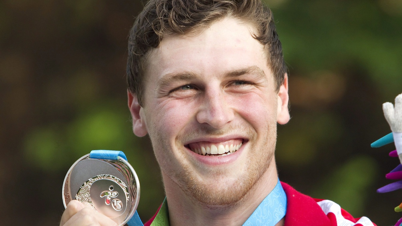 Canada's Cameron Smedley with his silver medal in the Men's Canoe (C1) final at the Minden White Water Preserve.