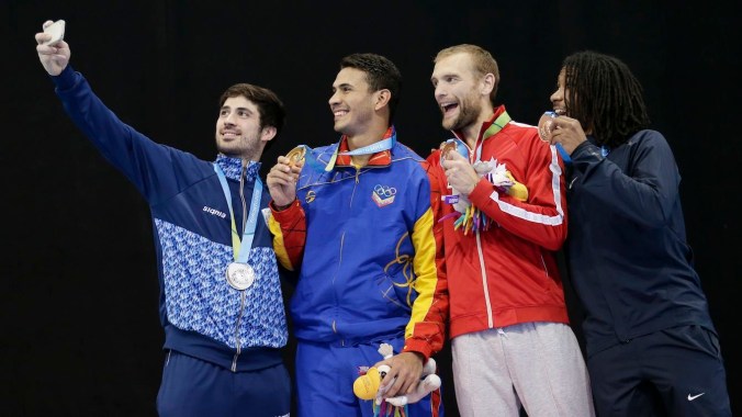 Jason Pryor, Ruben Limardo, Jose Dominguez, Hugues Boisvert-Simard Epee fencing medallists pose for a selfie