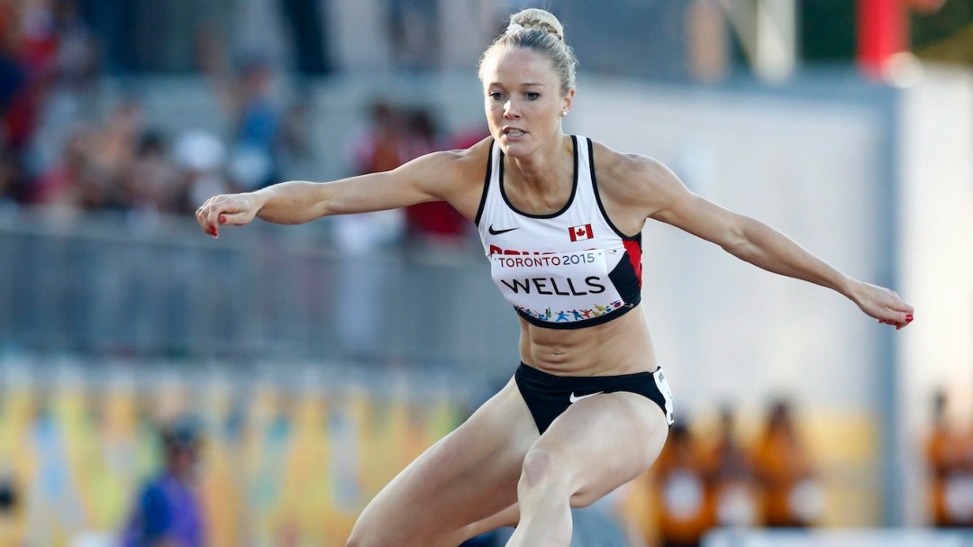 Sarah Wells competing in hurdles