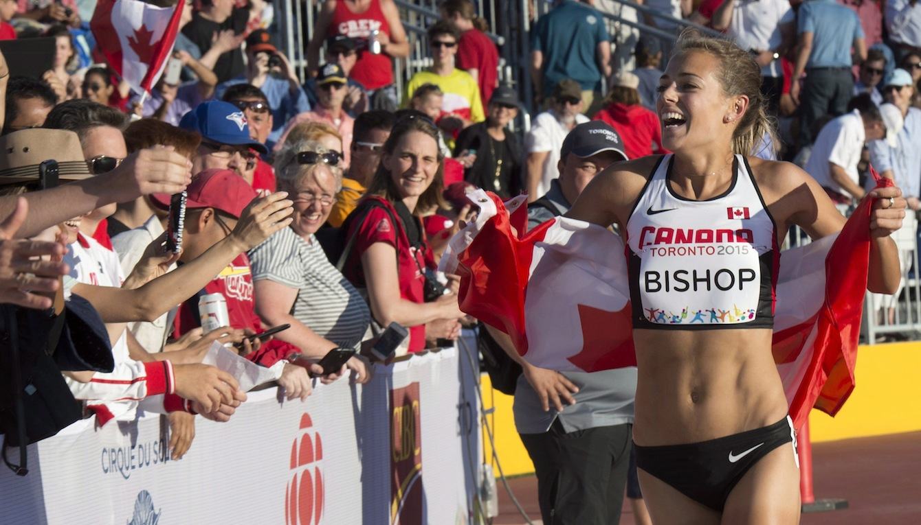 Melissa Bishop, of Canada, left, celebrates winning a gold medal in the women's 800m final during the athletics competition at the 2015 Pan Am Games in Toronto on Wednesday, July 22, 2015.