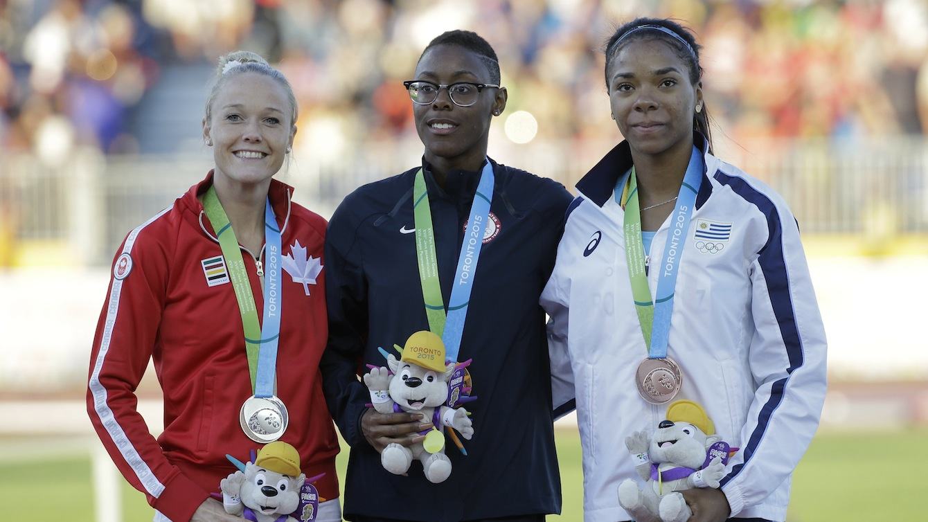 Shamier Little, Sarah Wells and Deborah Rodriguez pose on the podium