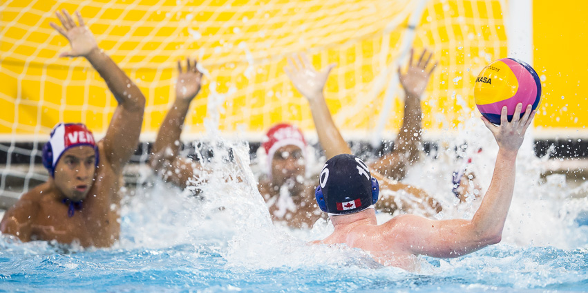 Christine Robinson (#10) doesn't get much room to shoot as Canada takes on Venezuela in a men's water polo preliminary match at the Atos Markham Pan Am/Parapan Am Centre in Markham, Ontario on July 9, 2015.
