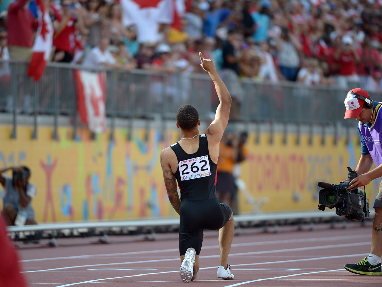 Andre De Grasse celebrates after his 200m Pan Am Games win in Toronto on July 24, 2015. 
