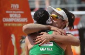 Agatha and Barbara of Brazil embrace during their match against Canada's Humana-Paredes and Pischke. (Photo: FIVB)