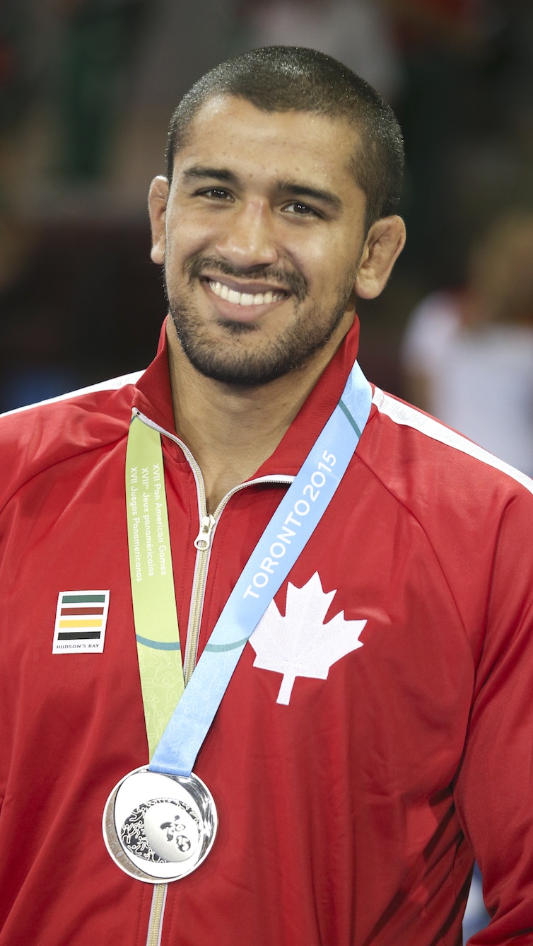 Arjun Gill (blue) of Surrey, B.C. was the silver medalist in the freestyle wrestling preliminaries at the PanAmerican Games in Mississauga, Ont., Saturday, July 18, 2015. Photo by Mike Ridewood