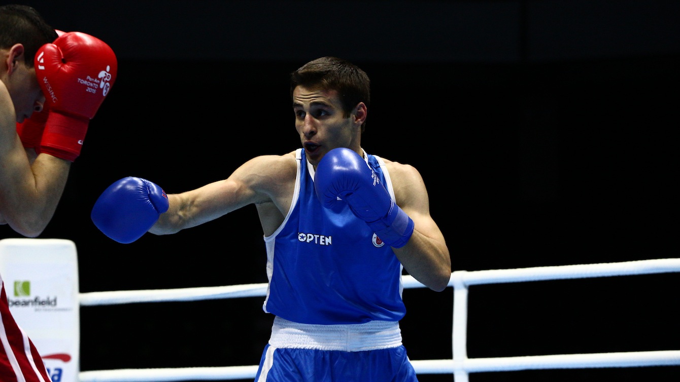 Team Canada's Arthur Biyarslanov throws a punch during his quarterfinals fight