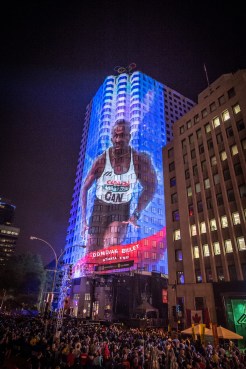 Large wall projections of Olympic legends, such as Donovan Bailey, were on display for the gathered audience at Canada Olympic Excellence Day on July 9, 2015 in Montreal.