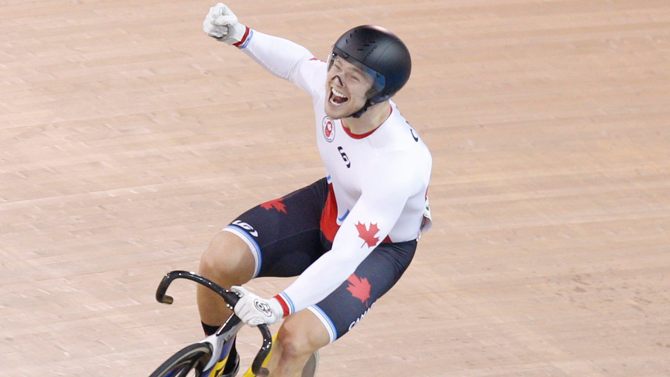 Hugo Barrette celebrates winning gold at the Pan Am Games in men's sprint on July 18, 2015. 
