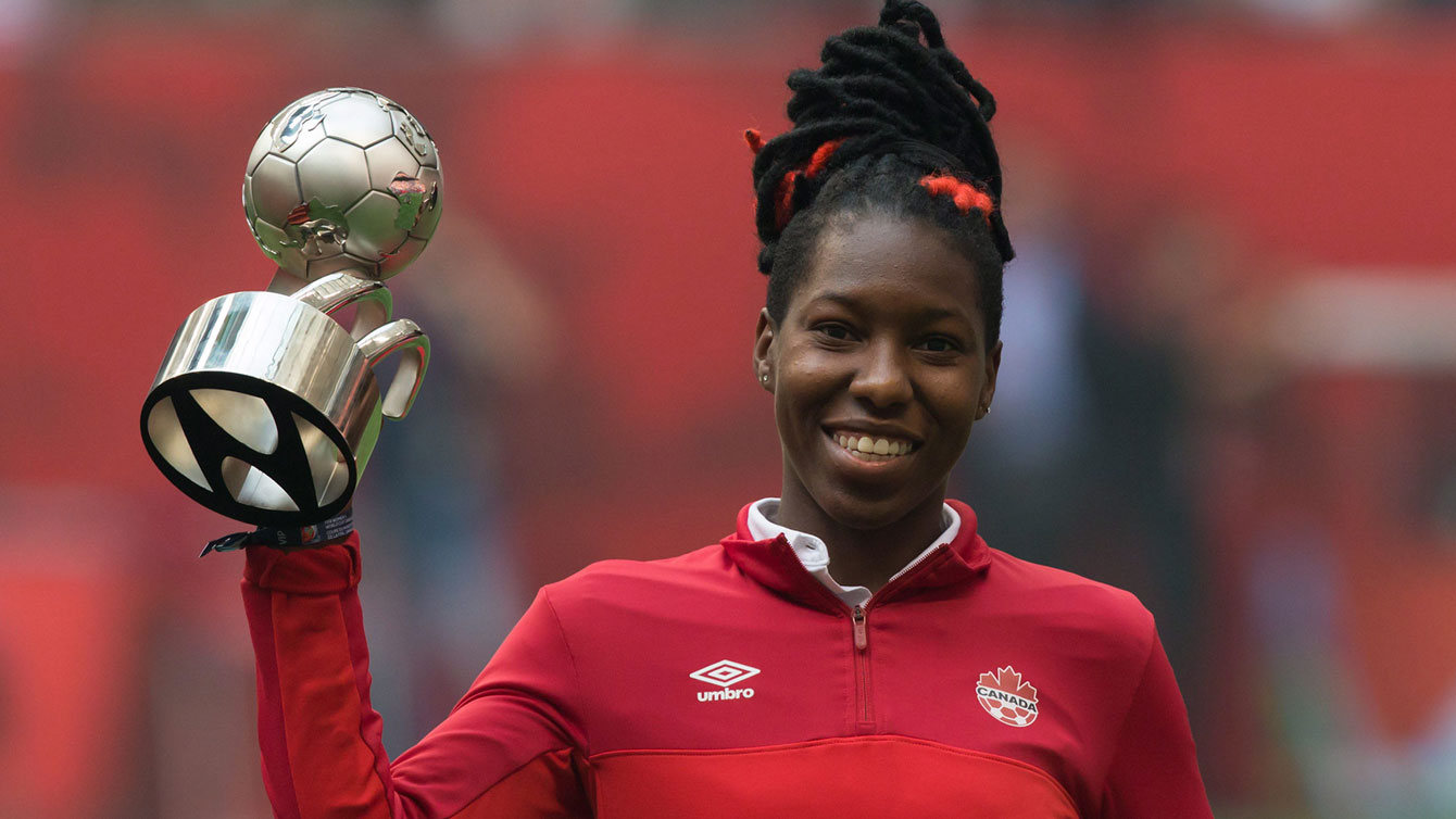 Kadeisha Buchanan holds up the best young player award from 2015 FIFA Women’s World Cup.