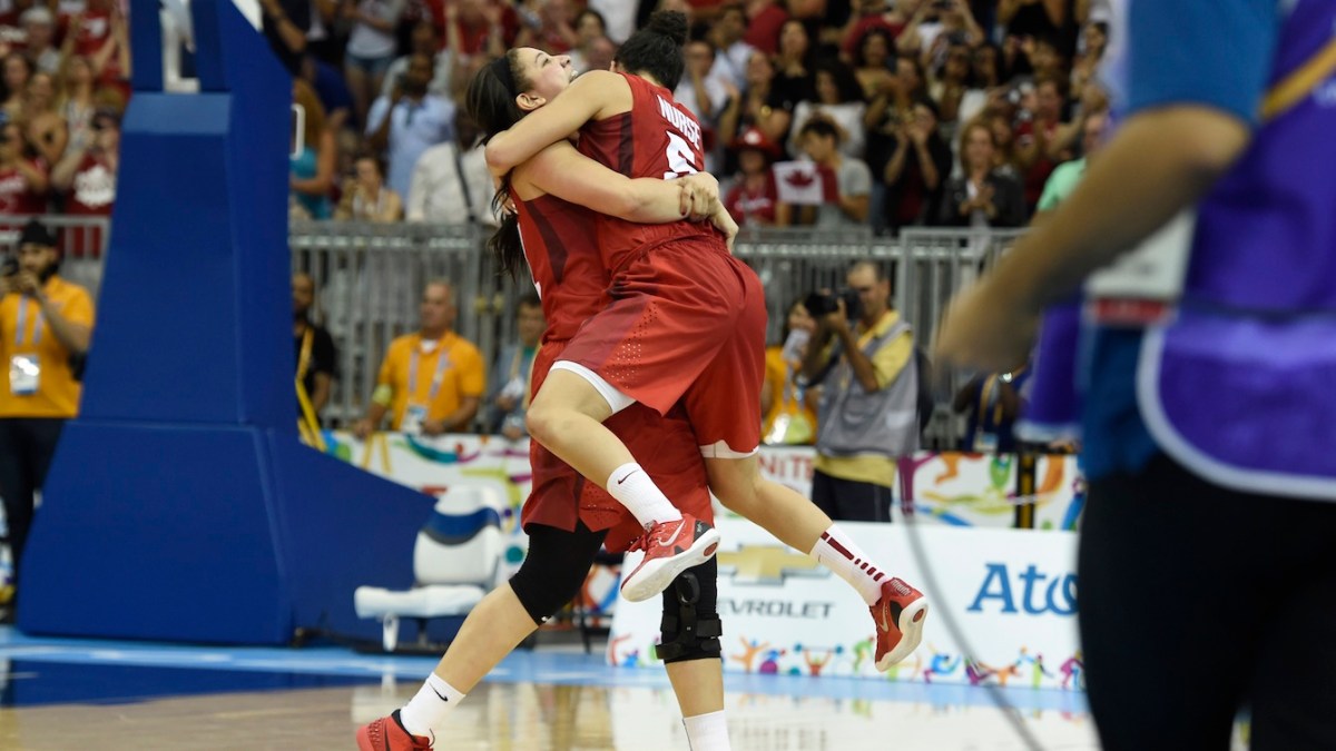 Team Canada's women's basketball team celebrates winning gold