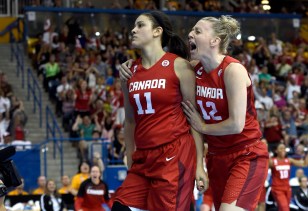 Natalie Achonwa (11) and Lizanne Murphy celebrate against USA in Pan Am Games basketball gold medal final on July 20, 2015.