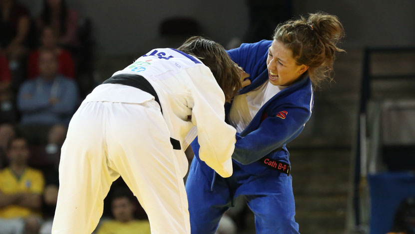 Catherine Beauchemin-Pinard (blue) and Marti Malloy of the United States in their Pan Am Games gold medal bout on July 12, 2015. 