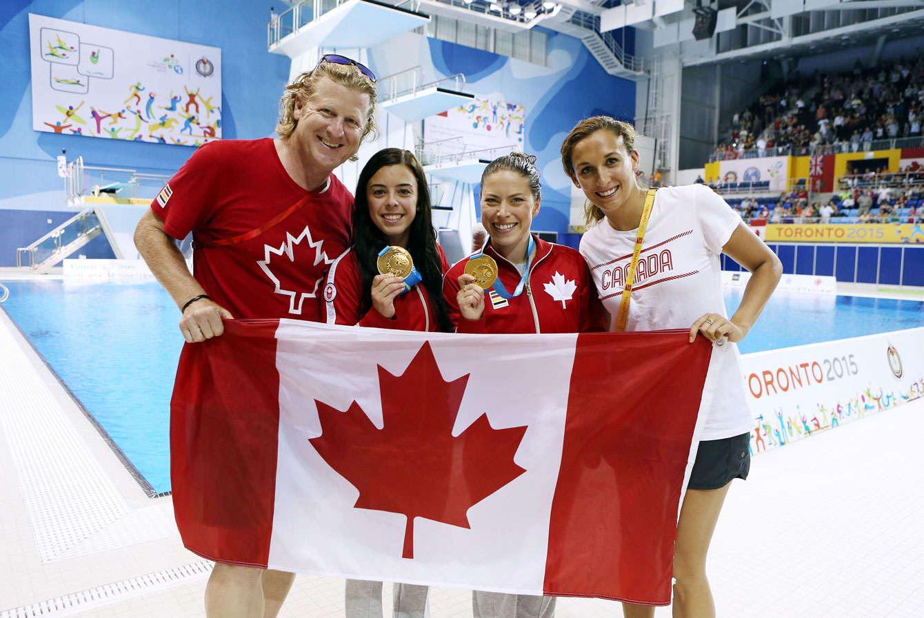 Harnett (far left) and Marcotte (far right) help celebrate the synchro diving gold won by Meaghan Benfeito (left centre) and Roseline Filion