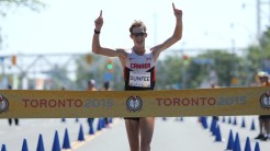 Evan dunfee crossing finish line