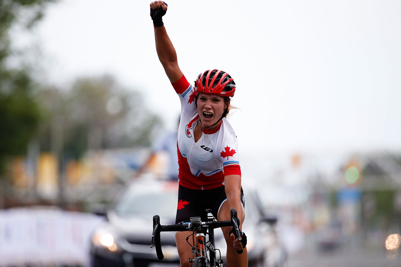 Jasmin Glaesser celebrates after winning the TO2015 cycling road race.