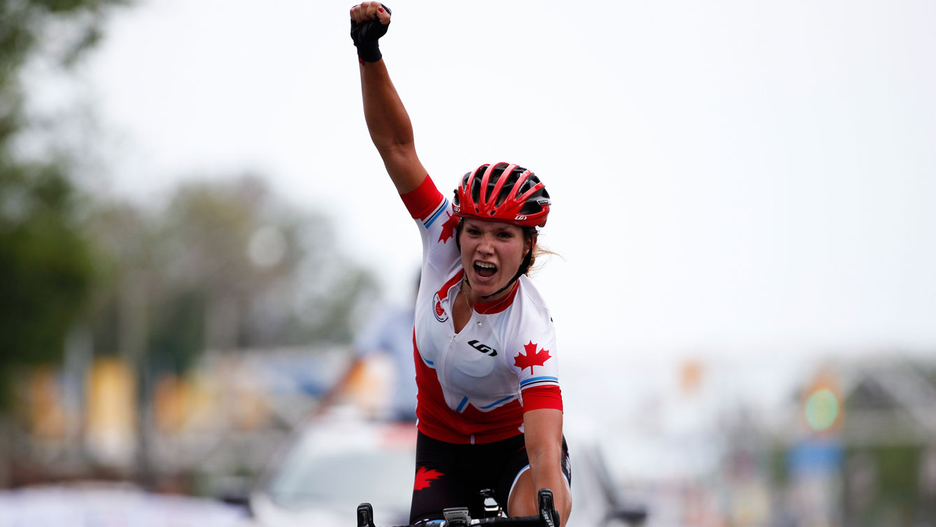 Jasmin Glaesser lets out a massive yell after crossing the line for TO2015 gold int he women's road race on Day 15.