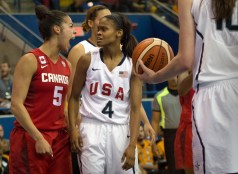 Moriah Jefferson of the United States looks on as Canada's Kia Nurse celebrates a basket and foul during gold medal action at the Pan American games in Toronto, July 20, 2015 (COC Photo by Jason Ransom).