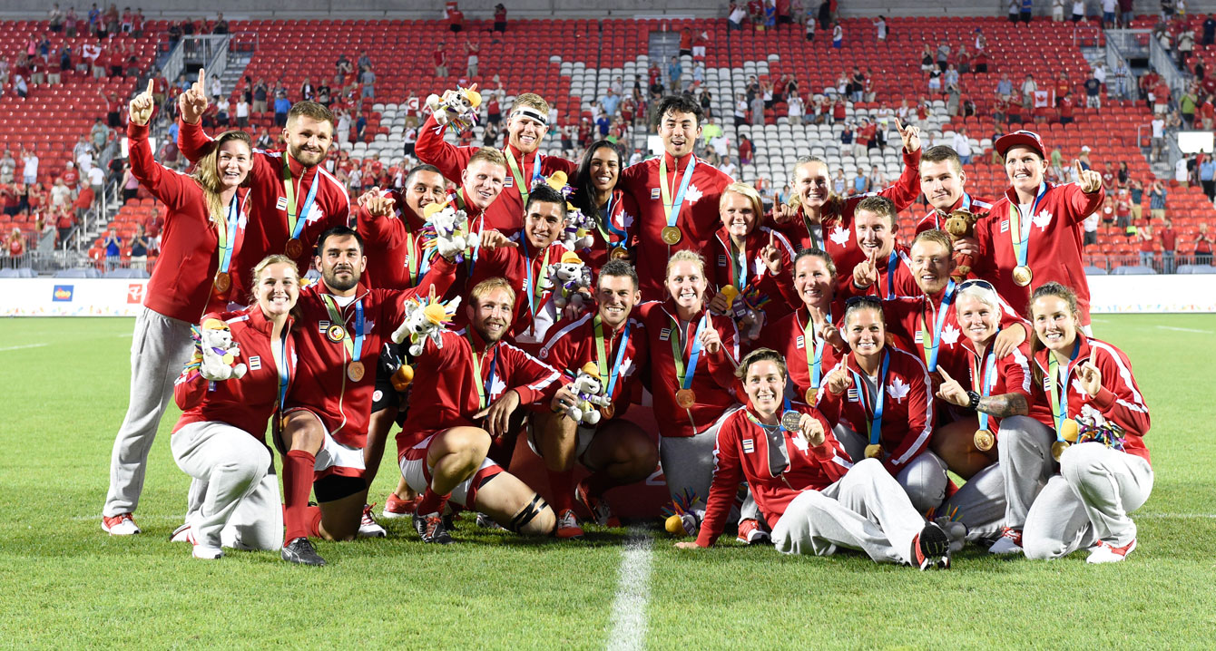 The men's and women's team gather with their gold medals to celebrate what was a special day in the history of Rugby in Canada. (Photo: Jason Ransom)
