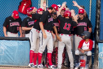 Team Canada celebrates another home run against Puerto Rico in men's baseball (Jeffrey Sze/COC).