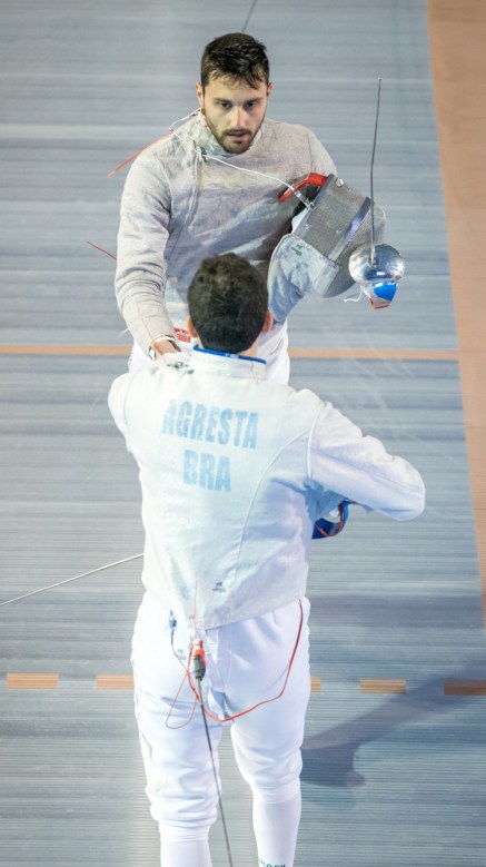 Joseph Polossifakis Joseph Polossifakis shakes his competitor's hand