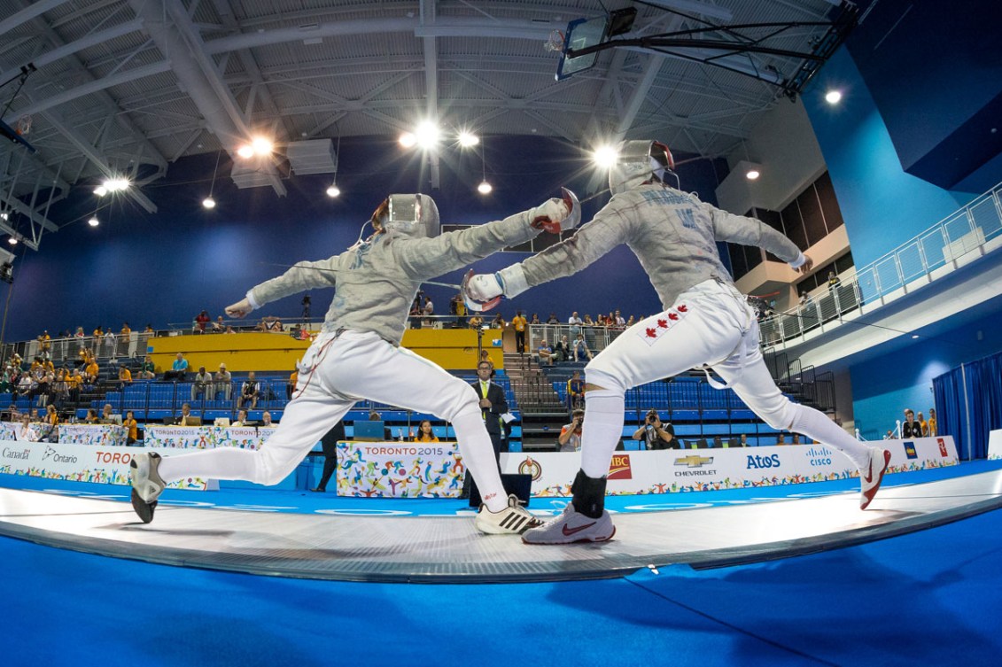 Joseph Polossifakis (right) helped the men's sabre team win TO2015 gold.