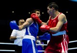 Team Canada's Arthur Biyarslanov fights Argentina's Lucas Gimenez, in the men's lightweight quarterfinals at Oshawa Sports Centre, July 21 2015 (John Fernandez for COC).