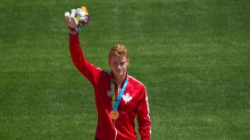 Shawnacy Barber celebrates gold in the men's pole vault
