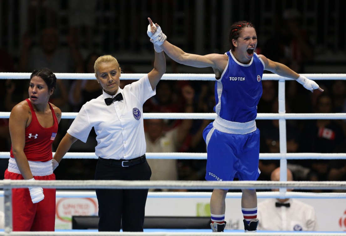Mandy Bujold celebrates her TO2015 gold in the women's fly (48-51kg) division on Day 15.