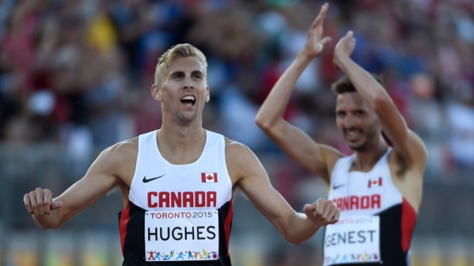 Matt Hughes and Alex Genest Matt Hughes and Alex Genest celebrate gold and silver, respectively, in the men's 3000m steeplechase