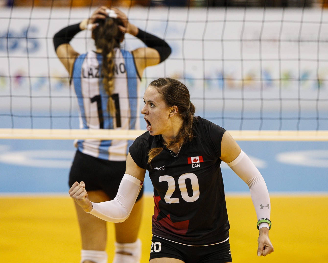 Contrasting emotions after a women's volleyball point at TO2015 (COC Photo by Michael P. Hall).