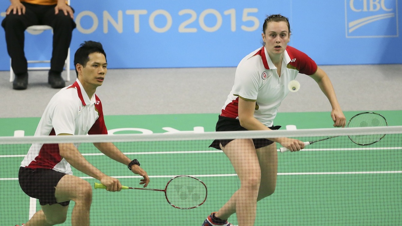 Alex Bruce (right) of Toronto and Toby Ng of Vancouver play in the mixed doubles badminton finals