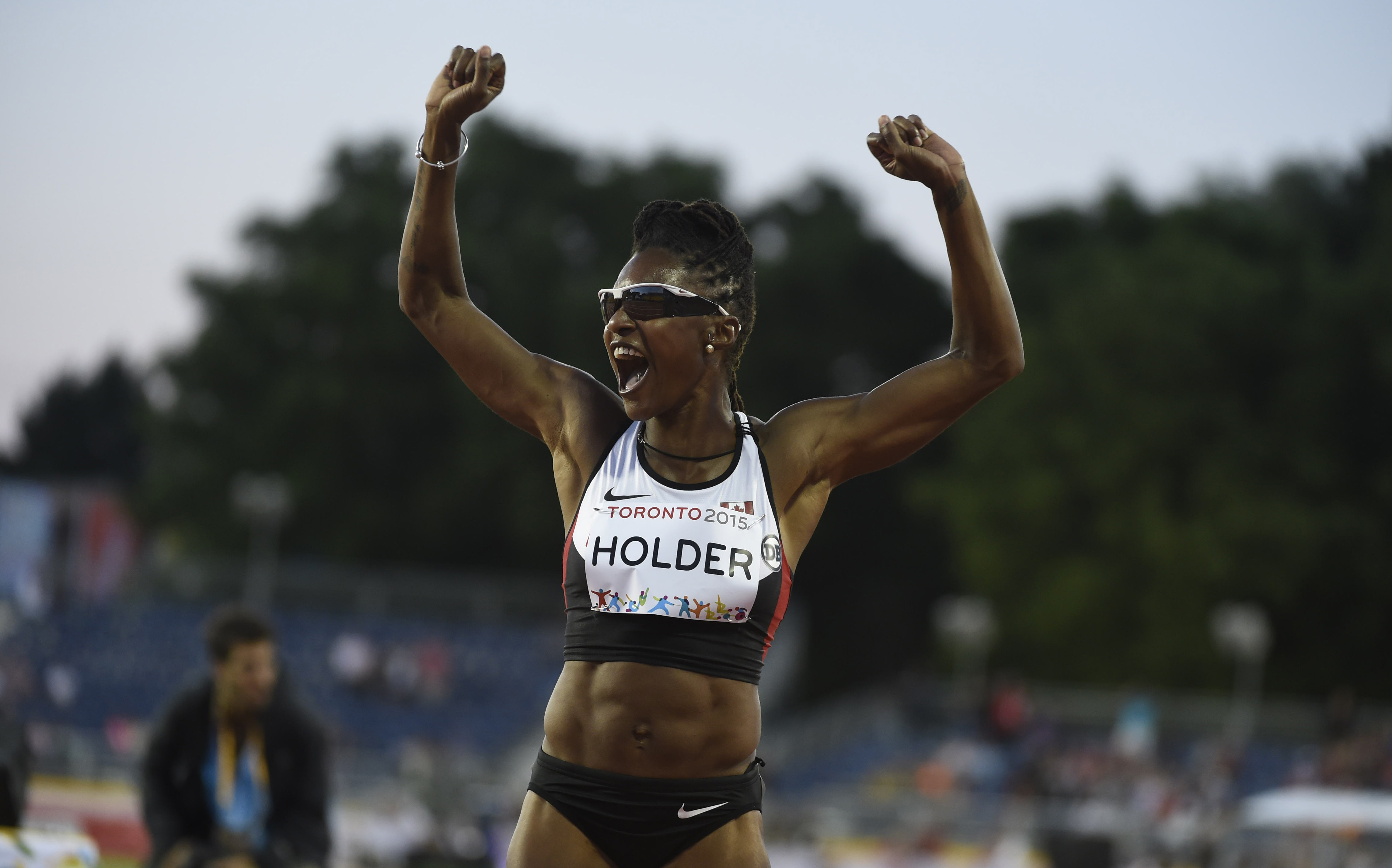 Nikkita Holder celebrates at the Pan Am Games, where she won bronze in the women's 100m hurdles on July 21, 2015.