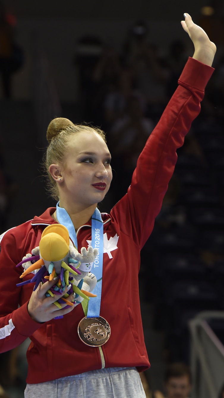 Patricia Bezzoubenko celebrates her bronze medal in the Individual All-Round competition in Rhythm Gymnastics at the Pan American Games in Toronto, July 18, 2015. Photo by Jason Ransom