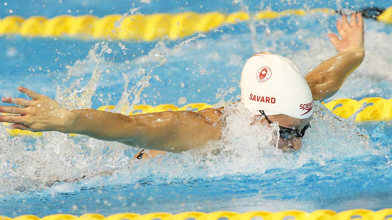 Katerine Savard swims the 100m butterfly at the Toronto 2015 Pan Am Games. .