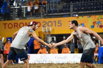Sam Schachter (left) and Josh Binstock for Team Canada in men's beach volleyball at the Pan Am Games (COC Photo by Jason Tse).