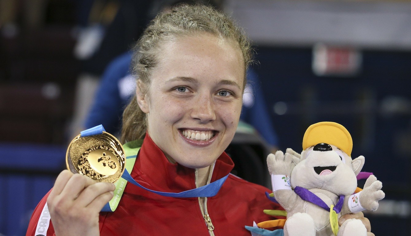 Dorothy Yeats (blue) of Montreal defeated Maria Acosta of Venezula for the gold medal in the freestyle wrestling finals at the PanAmerican Games in Mississauga, Ont.