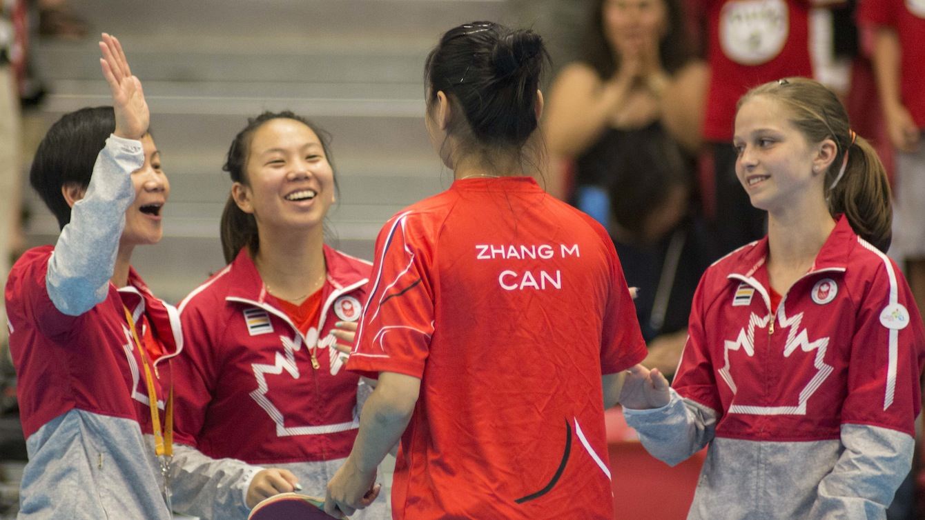 Canadian women's table tennis team celebrating their win