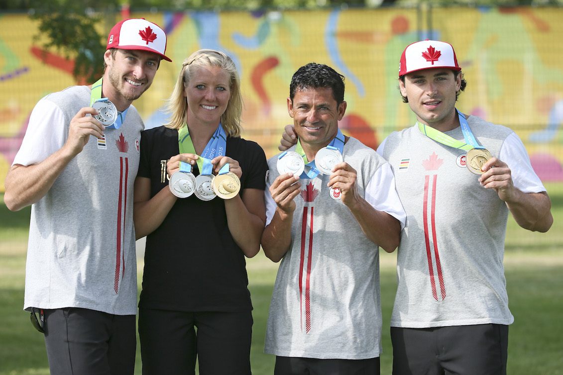 Jason McClintock, Whitney McClintock, Jaret Llewellyn and Ryan Dodd posing with their medals