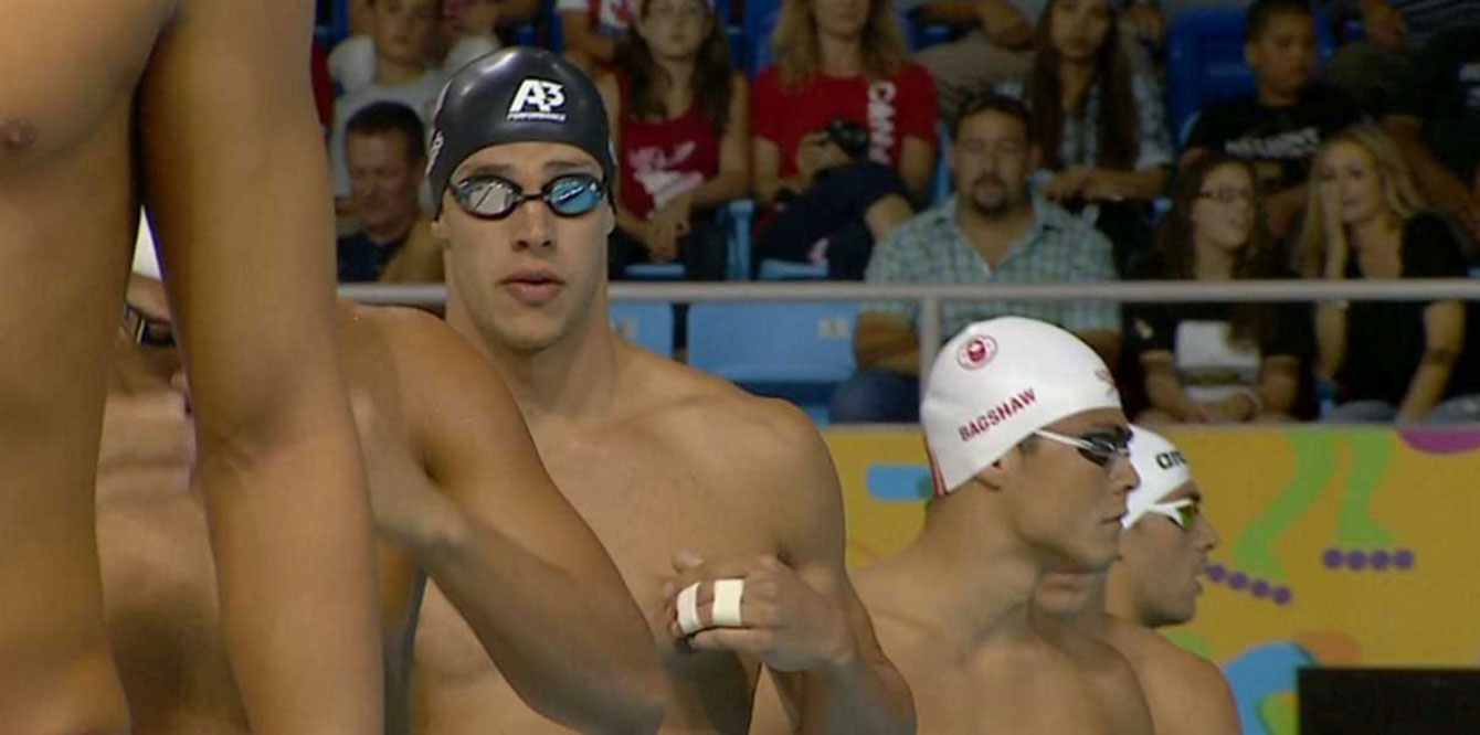 American relay swimmer Michael Weiss with two fingers taped together during the 4x200m freestyle relay.