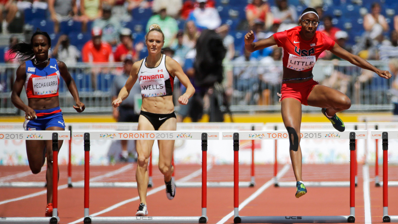 Sarah Wells (centre) and Shamier Little (right) in the 400m hurdles semifinals at Pan Am Games on July 21, 2015.