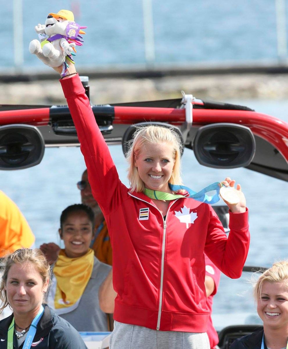 Whitney McClintock posing with her medal
