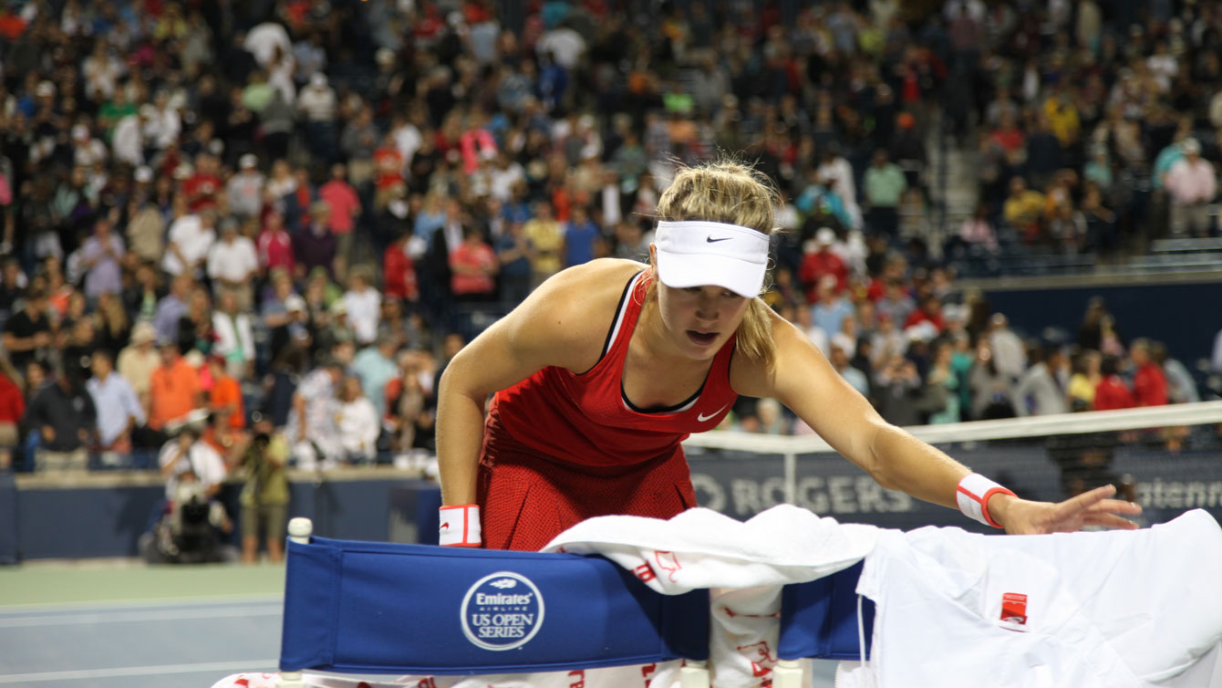 Eugenie Bouchard reaches for a towel at the end of her Rogers Cup exit on August 11, 2015. 