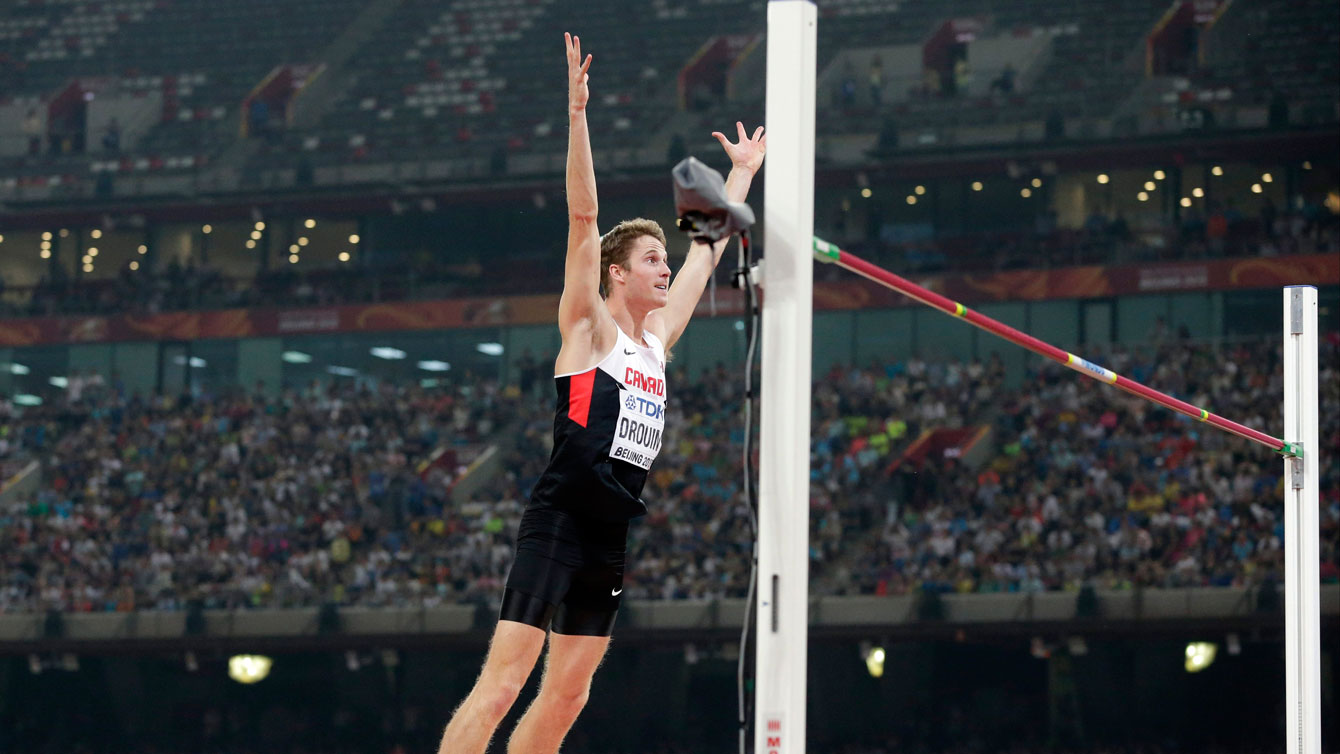 Derek Drouin celebrates a clearance in the high jump at the IAAF World Championships in Athletics on August 30, 2015.
