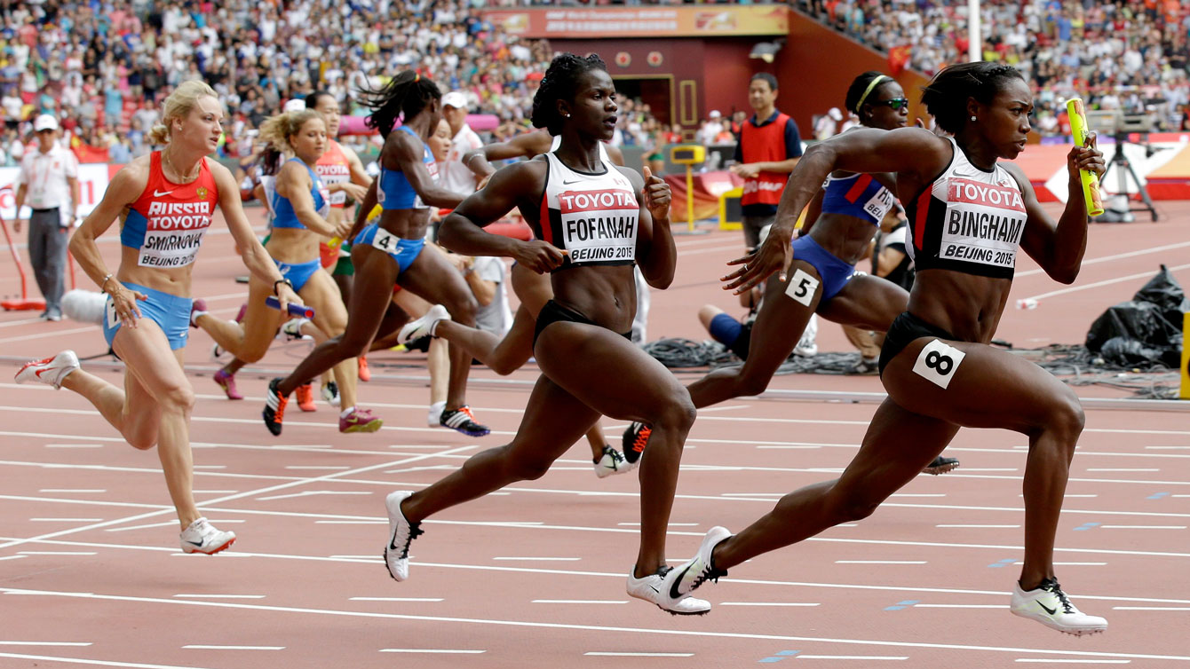 Isatu Fofanah to Khamica Bingham in women's 4x100m relay semifinals at the world championships in athletics on August 29, 2015. 