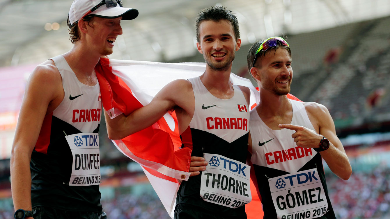 (L-R) Canada's Evan Dunfee, Ben Thorne and Inaki Gomez celebrate Thorne's bronze medal in the 20km race walk at the IAAF World Championships in Athletics Beijing on August 23, 2015.