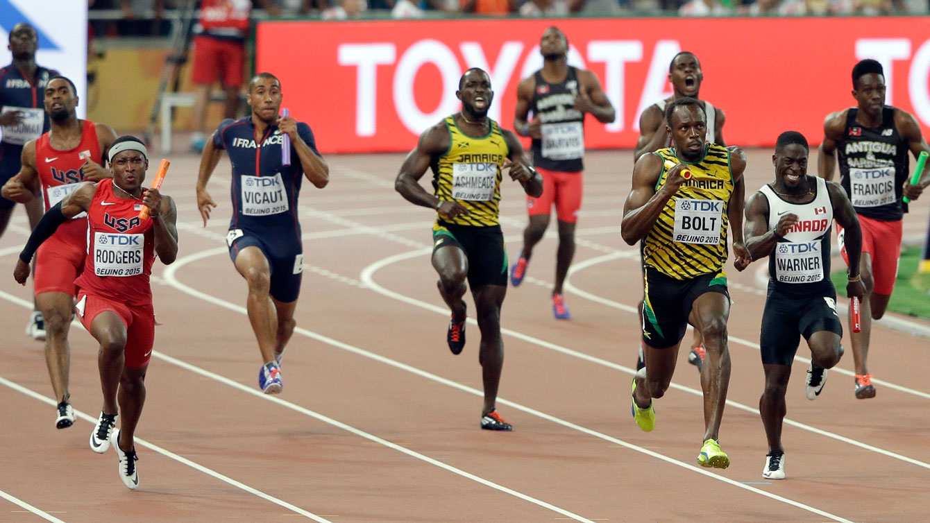The men's 4x100m relay pack tries to chase down Usain Bolt of Jamaica at Beijing 2015. 