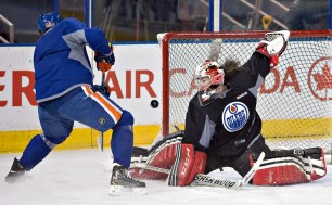 Szabados stops Nail Yakupov at Edmonton Oilers' practice on Wednesday, March 5, 2014. She was filling in for Viktor Fasth, he was en route from Anaheim after a trade.