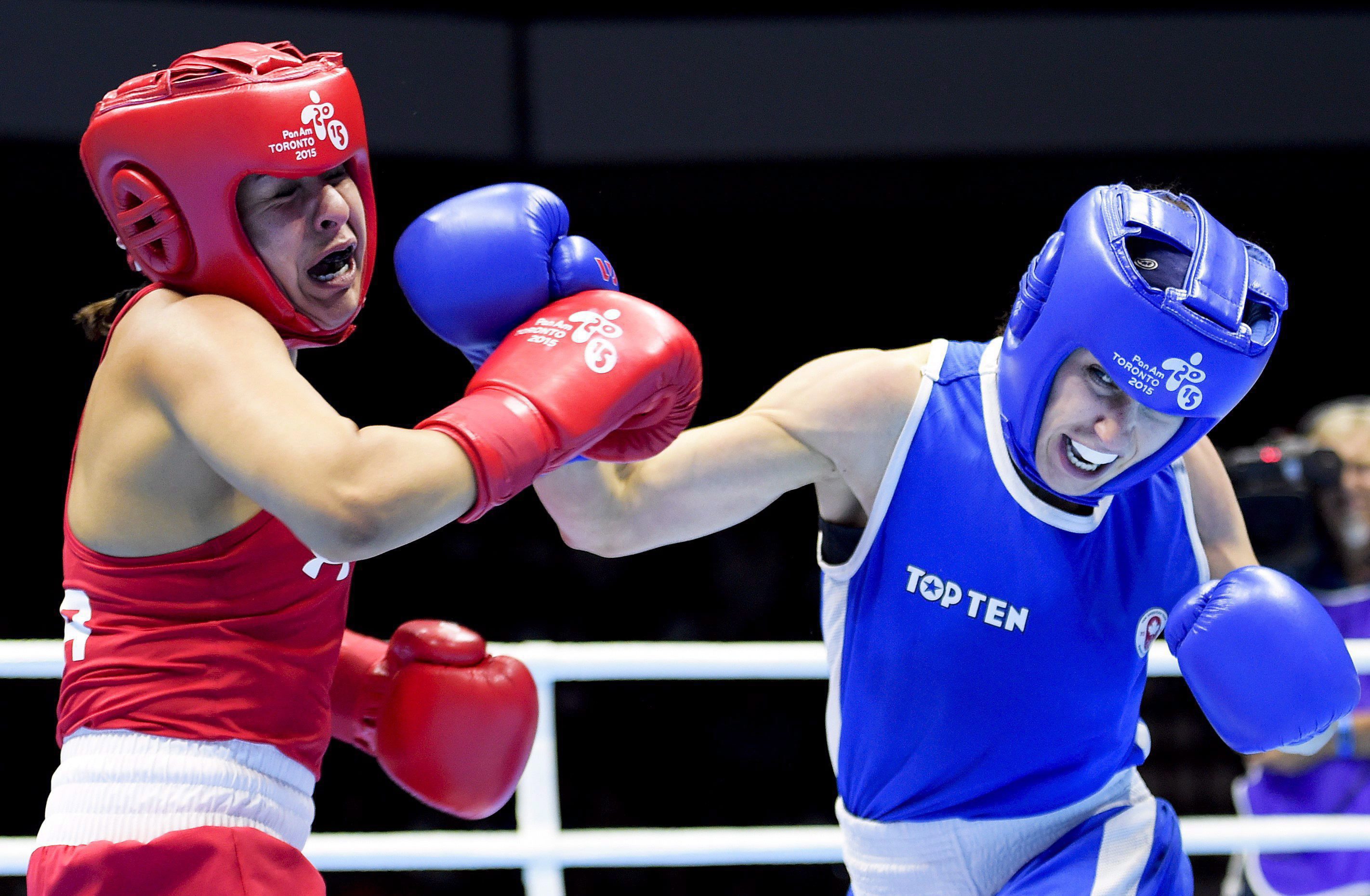 Mandy Bujold, right, of Canada, competes against Marlen Esparza, of the United States