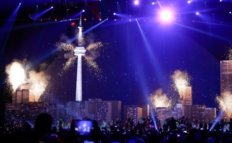 Fireworks go of from a model of the Toronto skyline on the stage of the closing ceremony of the Pan Am Games